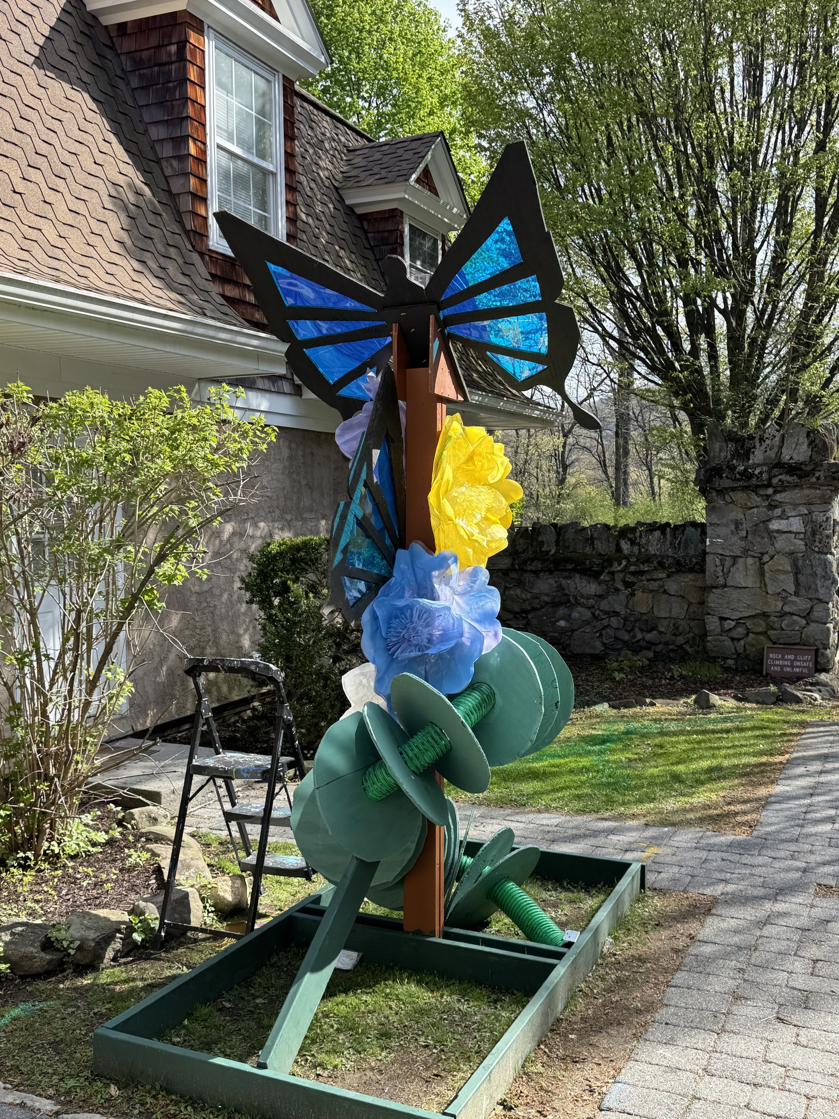 Blue and black butterfly environmental art installation outdoors