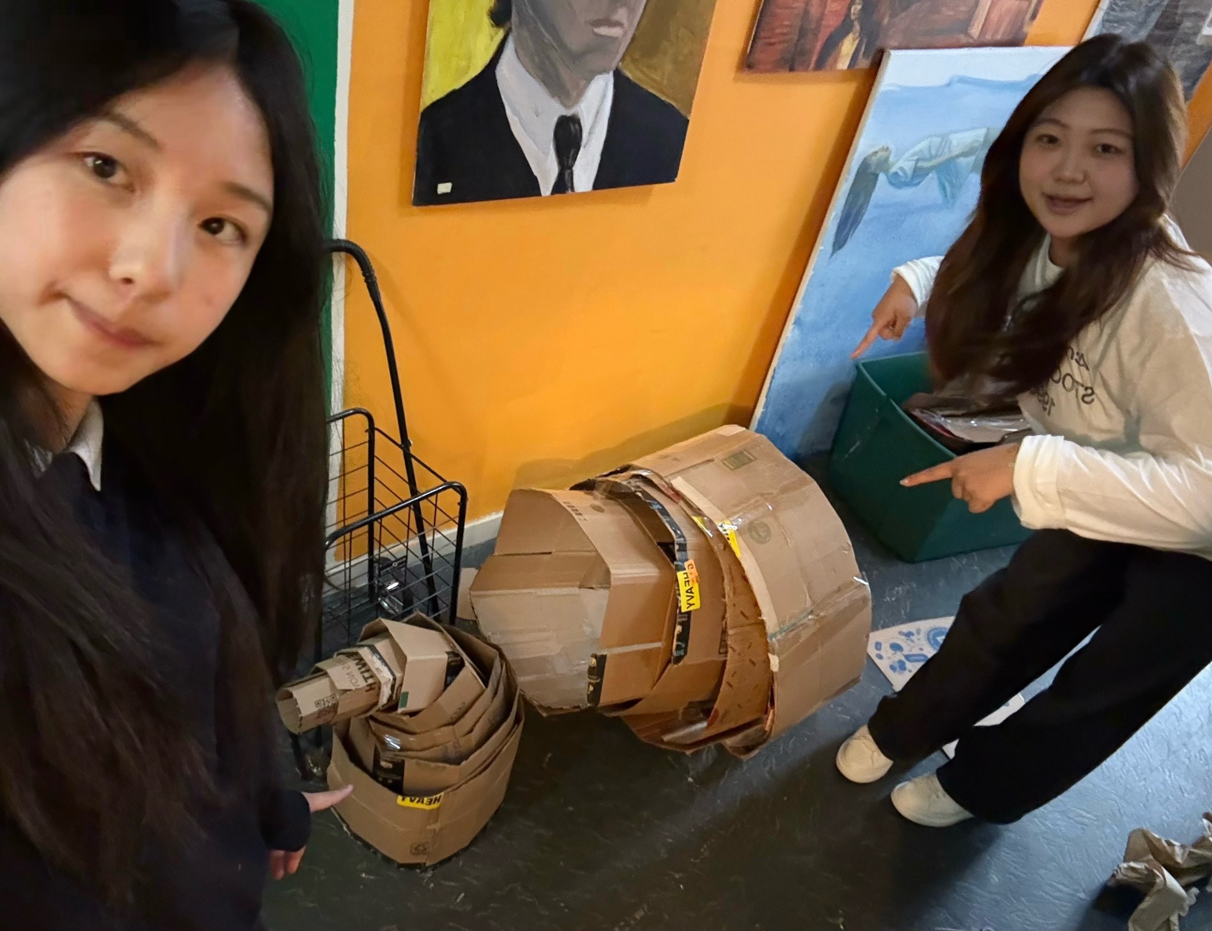 The artists with the early cardboard prototype
