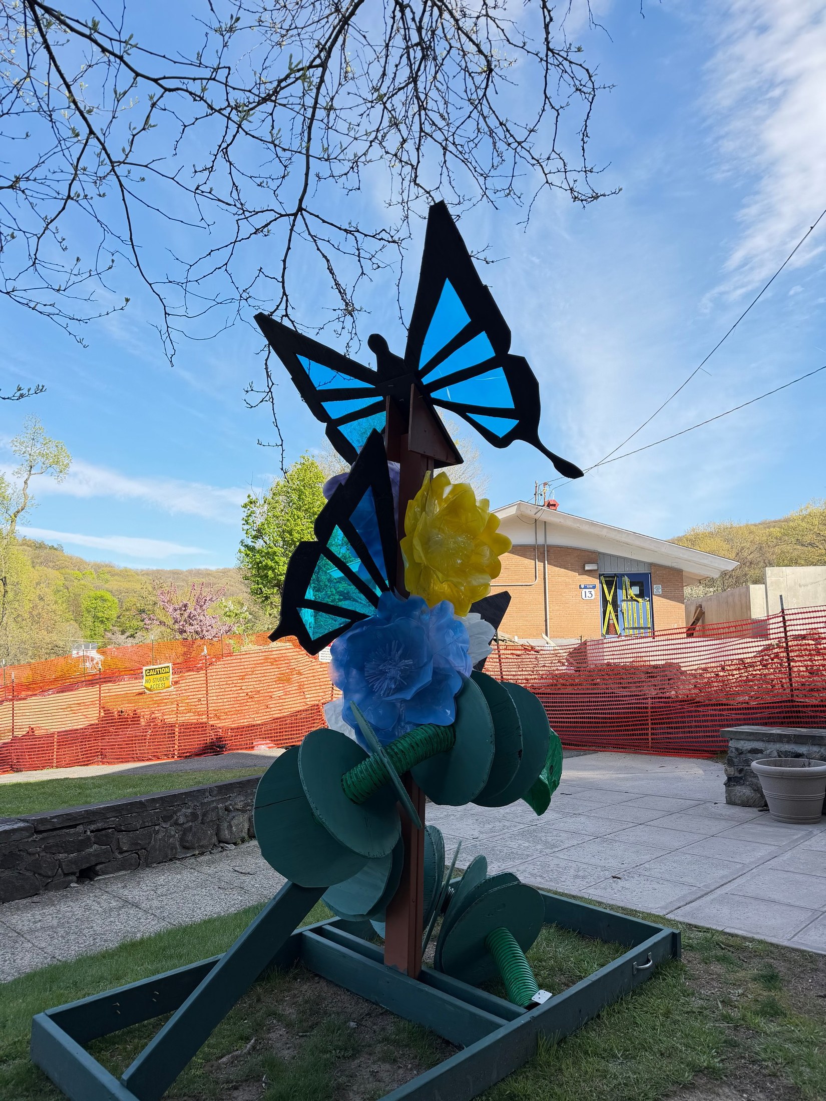 The completed Spring butterfly installation against the blue sky