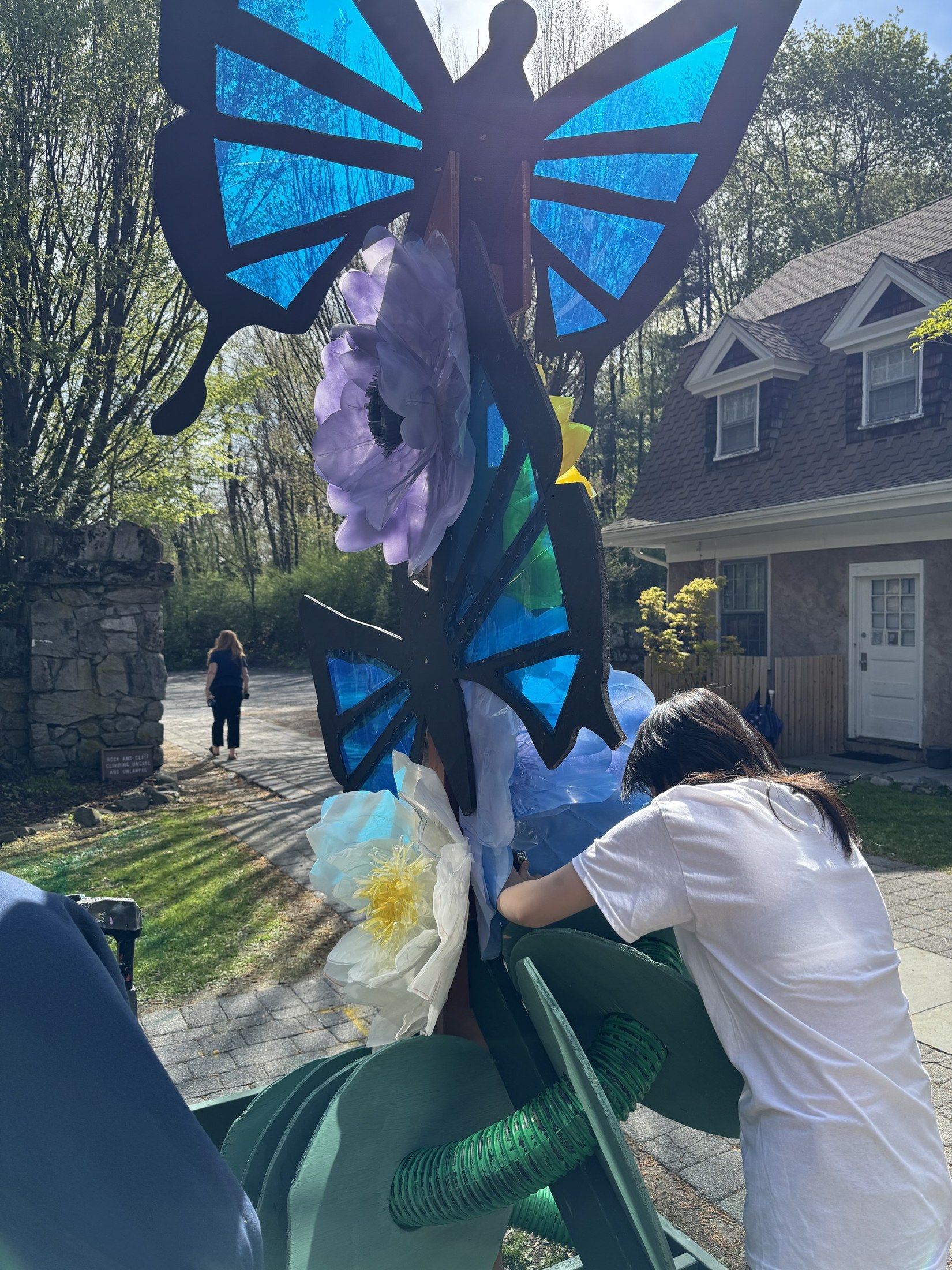 Installing flowers on the Spring artwork